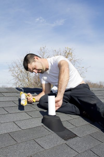 Homeowner-doing-roof-repair