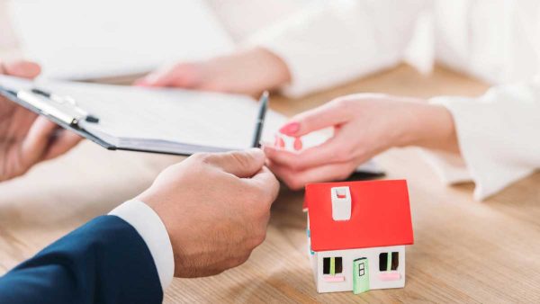 Woman transferring roof warranties